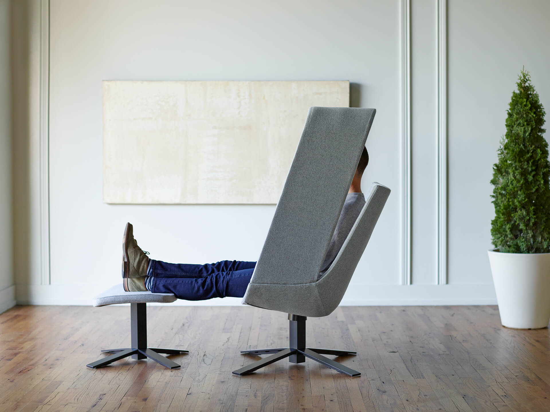 Haworth Mike Maaike Designer grey chair in office with someone sitting in it