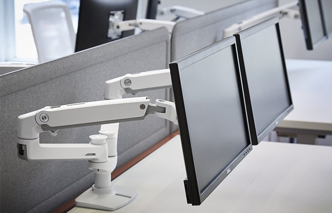 Haworth Ergotron monitor arms attached to a monitor
