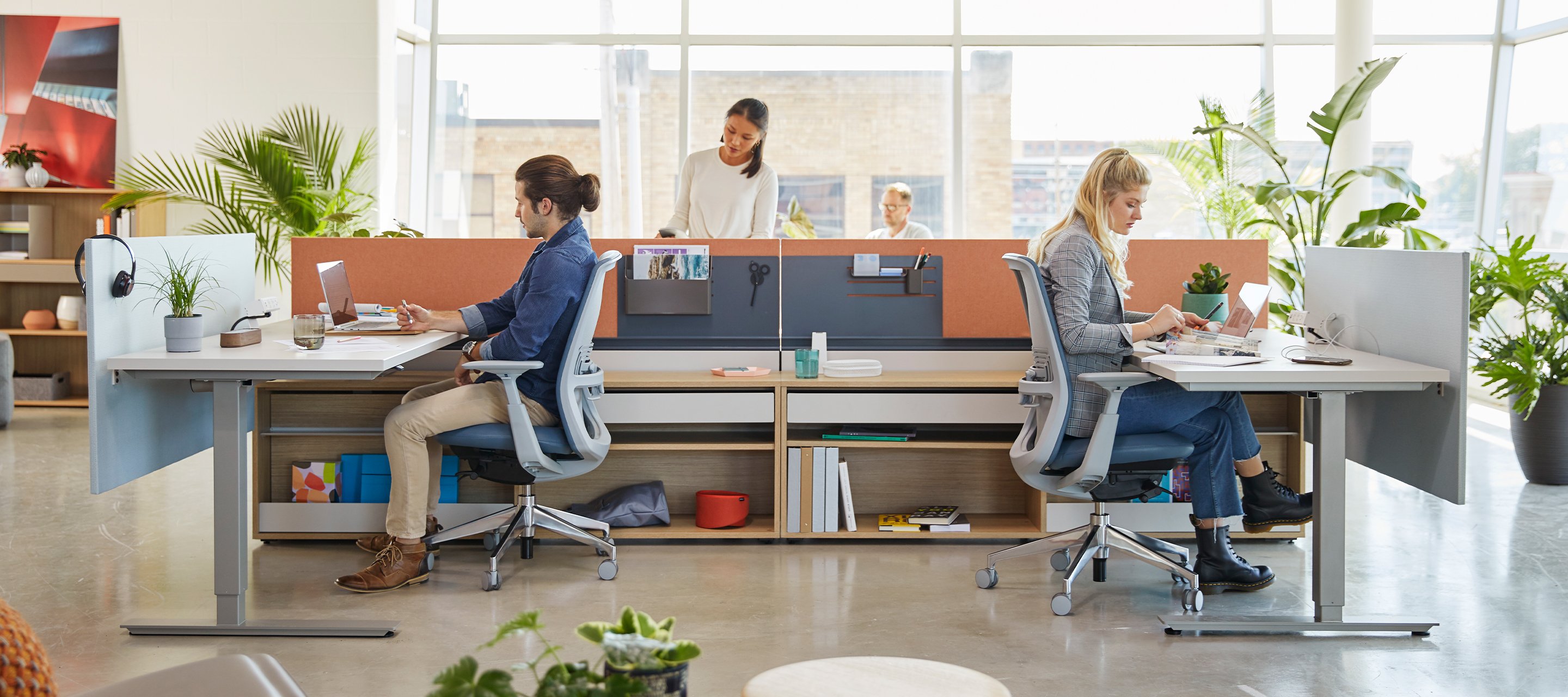 Haworth Zody chairs and Height adjustable table at 2 workstations in an office