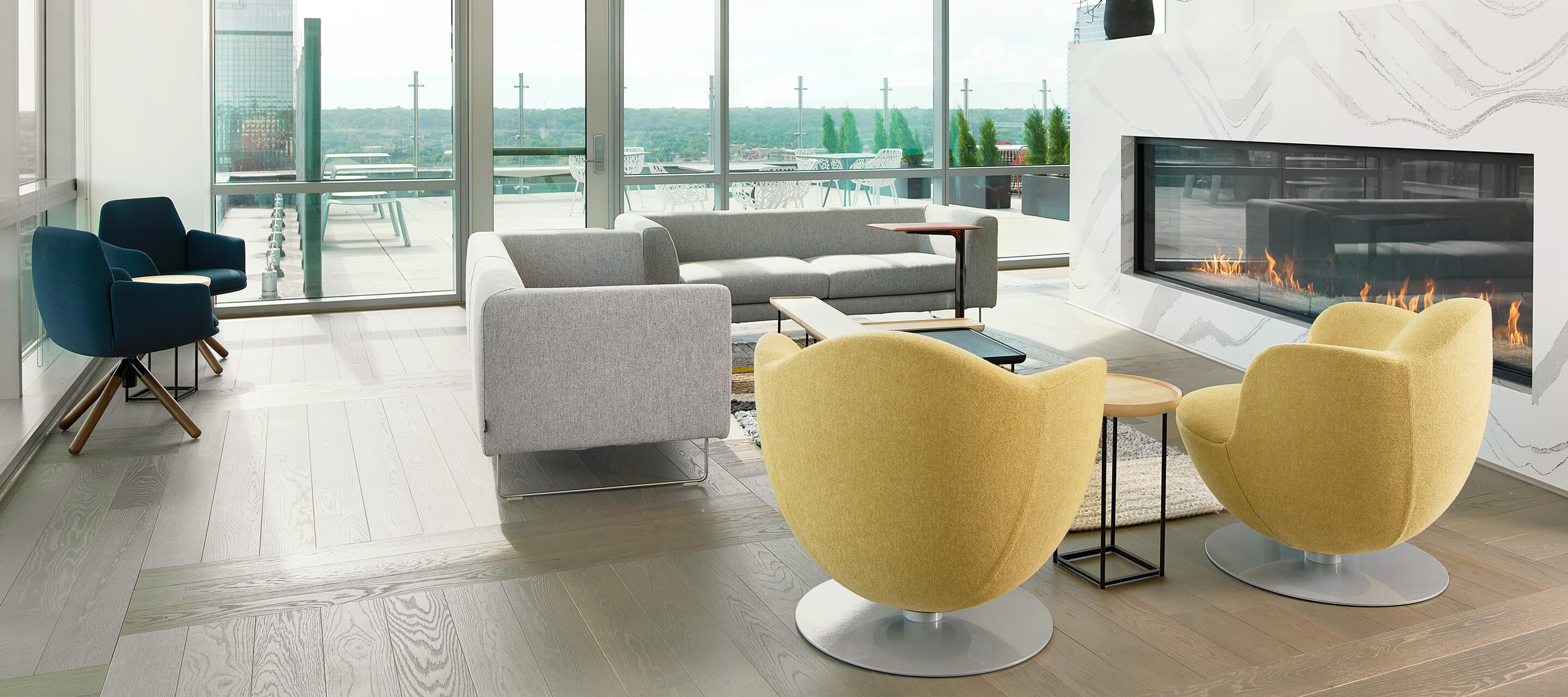 Haworth Poppy chair, LC2 lounge chair, Tulip chairs in a living room