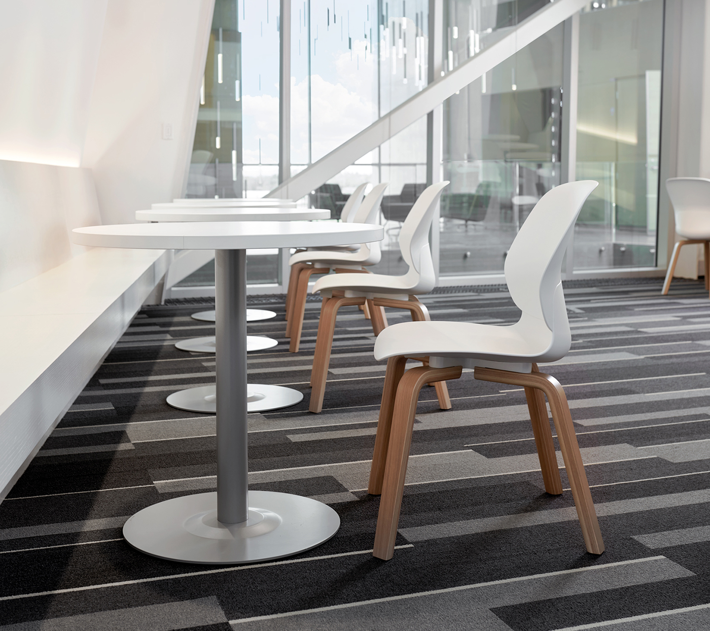 Haworth Maari chairs in white plastic base and wooden legs in a Dolese workspace