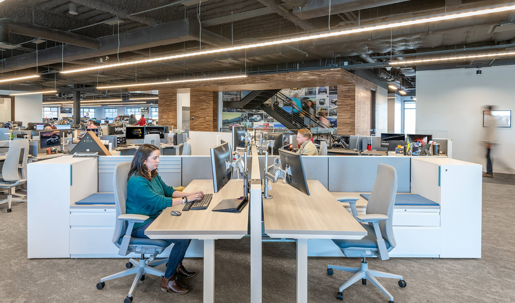 Individual workstations at Mercedes-Benz Financial Services were designed for maximum comfort and efficiency. Each station boasts a height-adjustable table, a Fern task chair for good ergonomics, and dual monitors. 