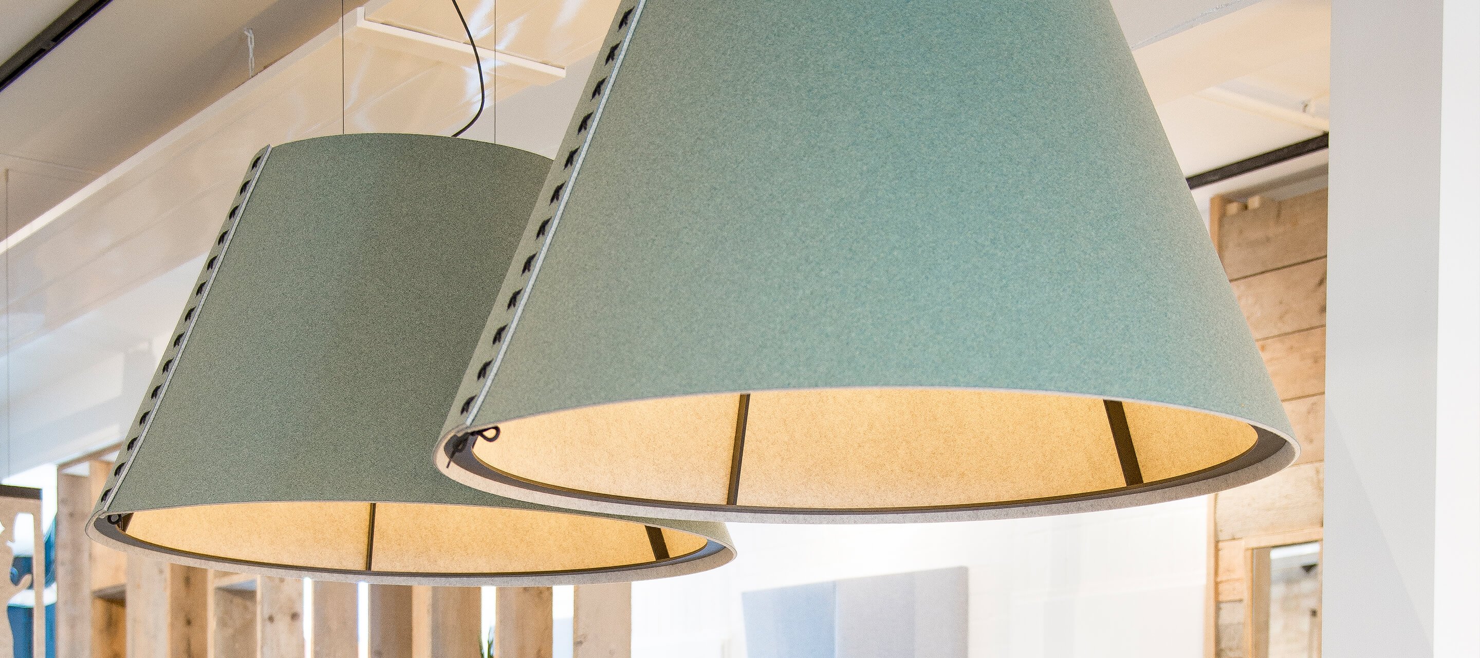Haworth Light Design Guide showing lamps hanging from a ceiling above an office table/