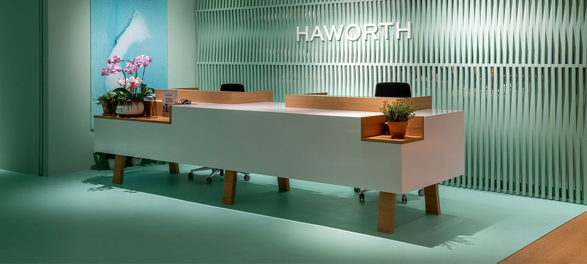 Reception area shows clear Haworth logo visual. The color choices represent the industry color trend.