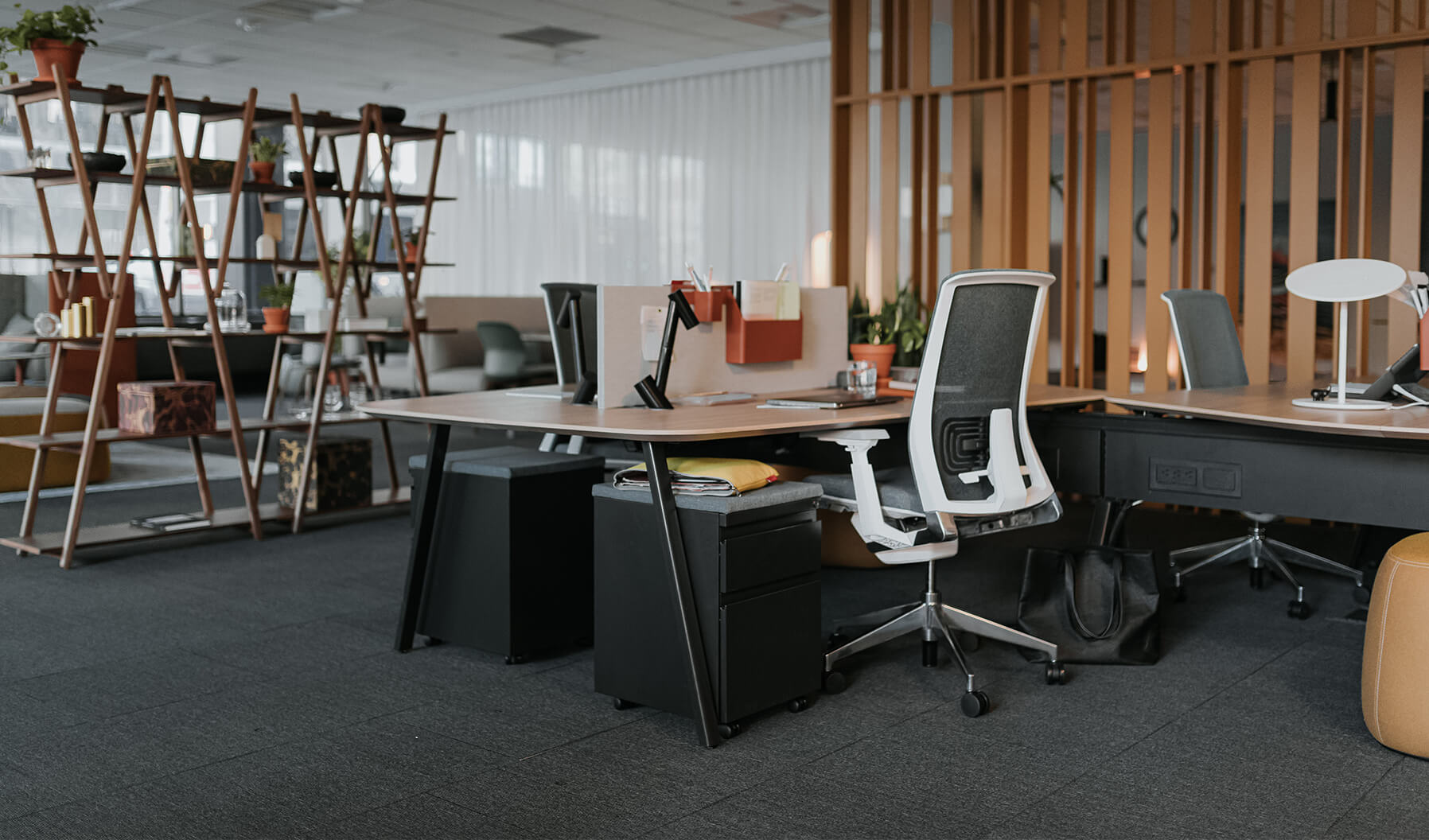The layering of spaces is demonstrated here in showing how a
workstation can be a close neighbor to other Social Spaces and lounge
areas. This environment allows for work to be done but the ability to be
connected to what is happening within the office environment.