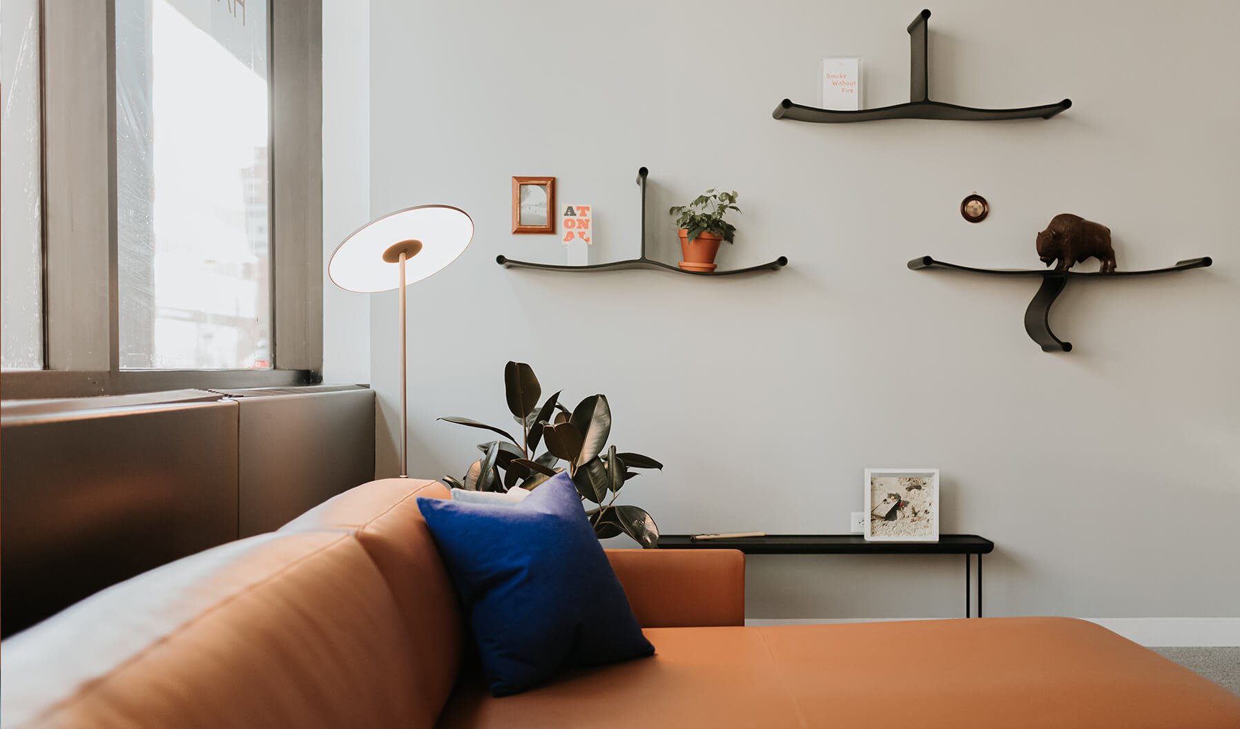 The range of products around this lounge application, such as the use of
Pablo Lighting and Cappellini shelving helps create a more intimate and
comfortable feel for a range of uses. .