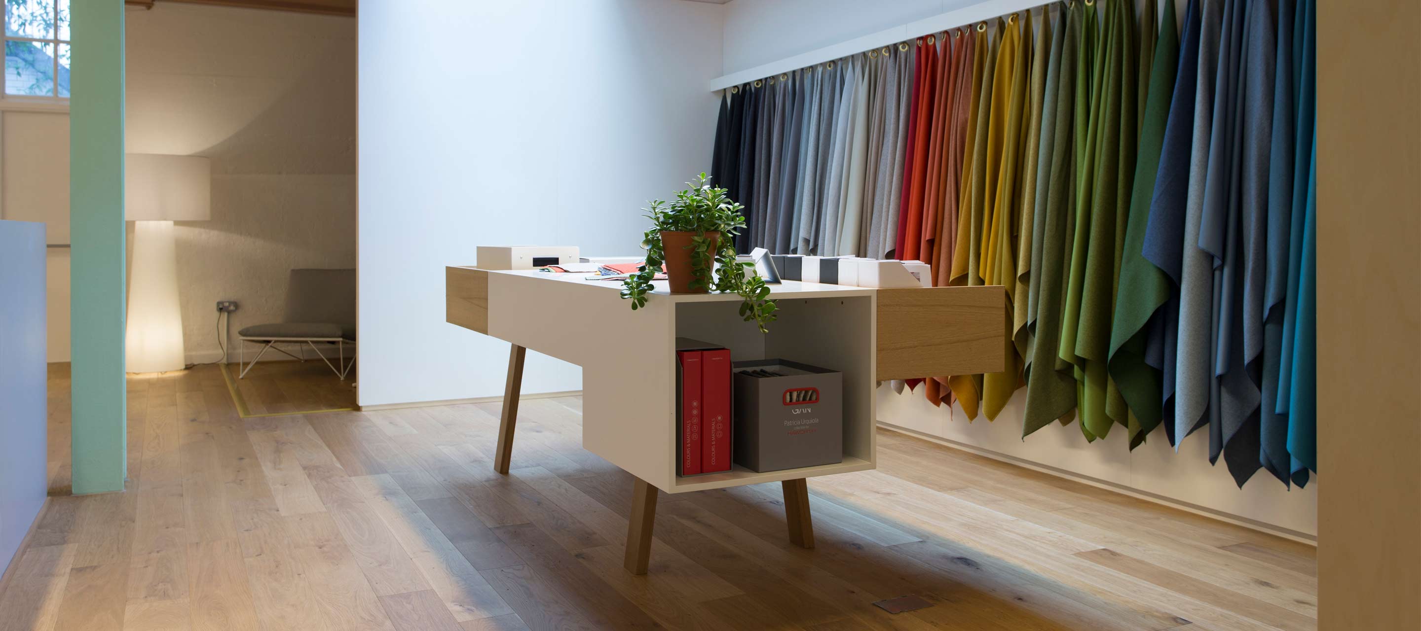 Visitors to the London showroom can feel our fabrics and see the finishes at this colors and materials sample station.