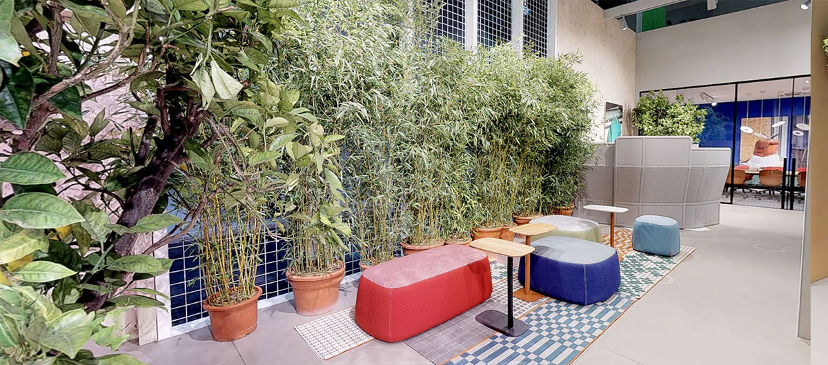 Superpouf cushions create a comfortable lounge area amidst the Vertical Garden.
