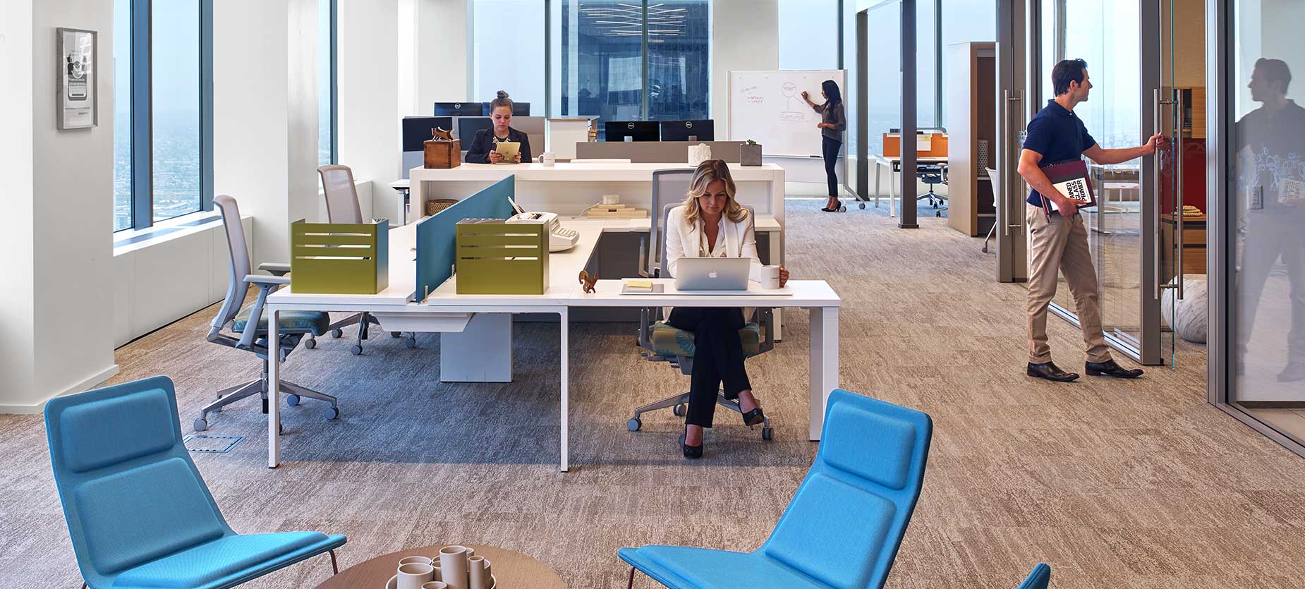 The layering of spaces is demonstrated here in showing how a workstation can be a close neighbor to other Social Spaces and lounge areas. This environment allows for work to be done but the ability to be connected to what is happening within the office environment.