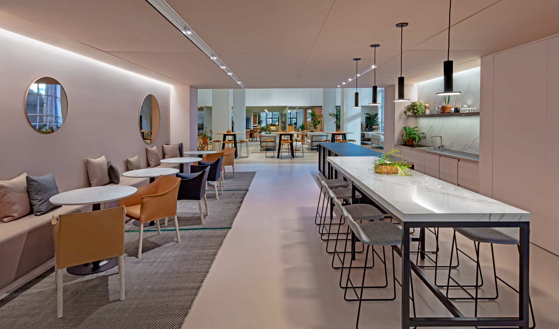 A multipurpose social hub with access to refreshments, the café encourage interaction and relaxation and connects the adjacent Community Social Space to individual workspaces.