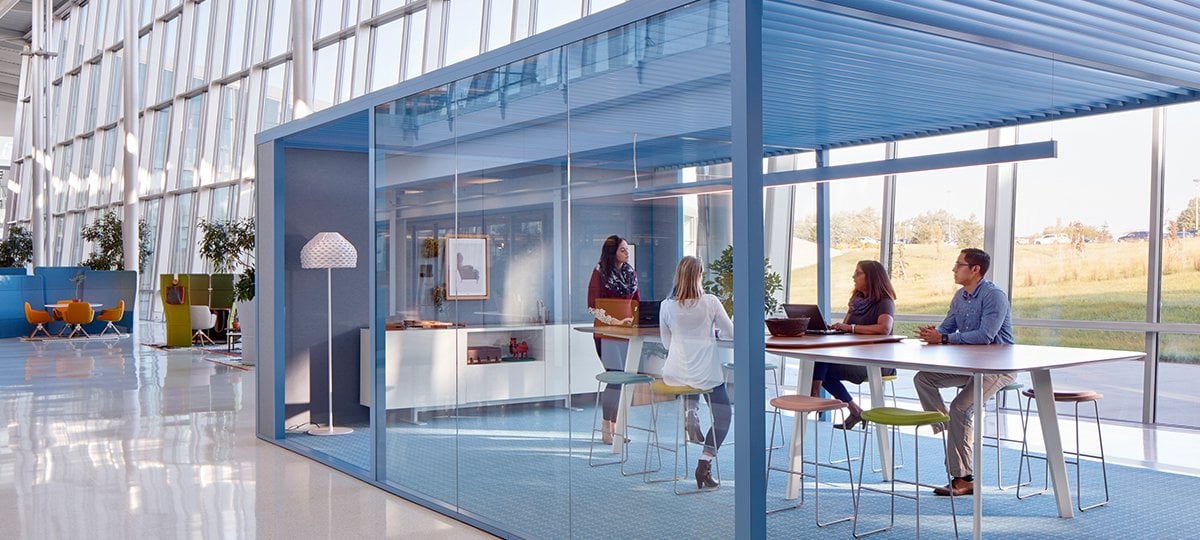 This meeting space was an design exploration of creating space within a space. The absense of doors, use of glass, gracious openings, and a louvered ceiling demonstrate how an enclosure can be open to the surrounding space and simultaneously provide privacy.