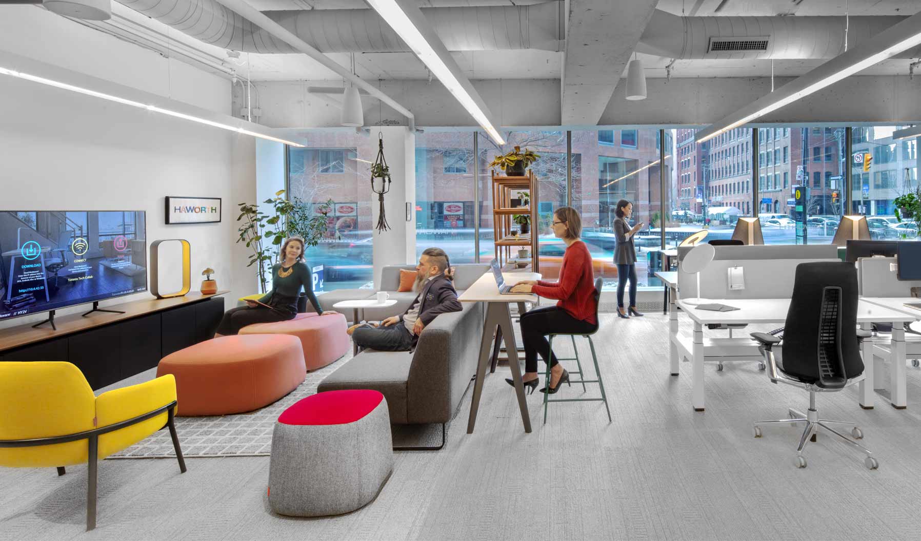 An open space with comfortable seating to encourage interaction and collaboration, a lounge supports relaxed seated postures and offers visual comfort. A variety of elements—lighting, rugs, and residential

materials—contribute to ambience.