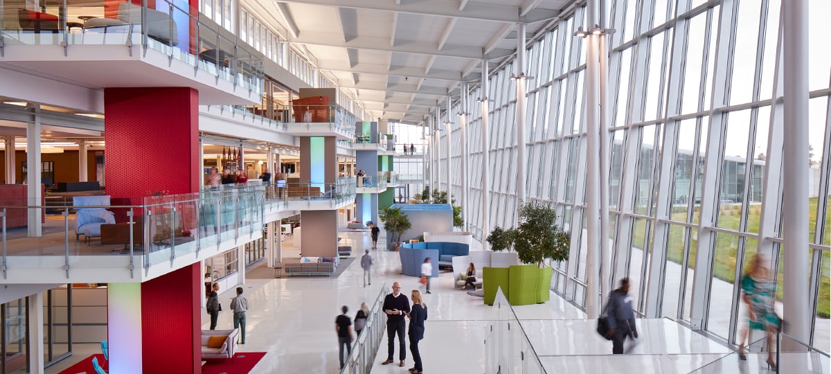 The atrium at One Haworth Center serves as a major thoroughfare for the building as well as an active collaboration zone. The vertical columns at each balcony serve as wayfinding for different office zones, and are a striking design feature that further elevate the buildings remarkable architecture.