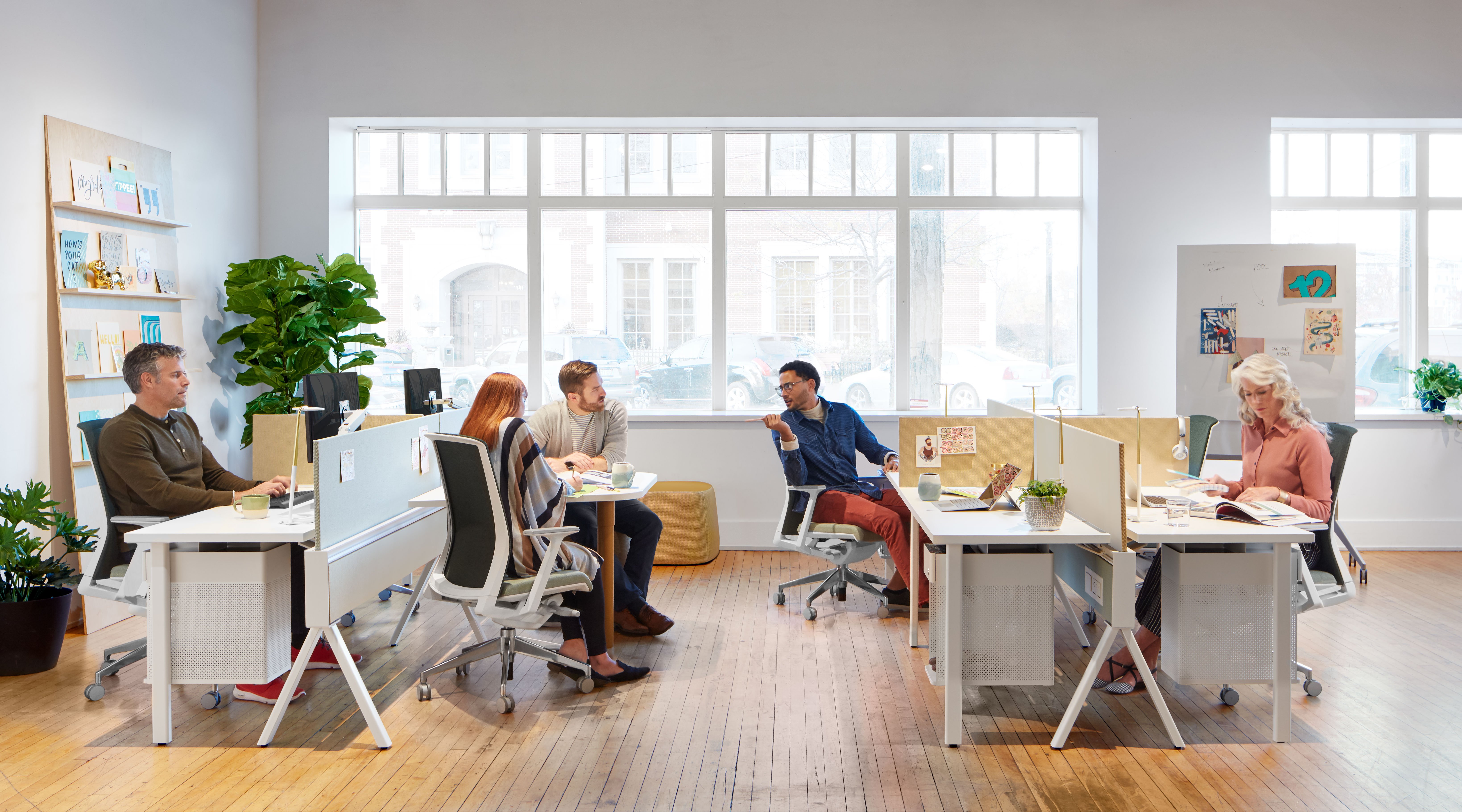 Haworth Compose Beam Workspace divider in an office space with employees interacting