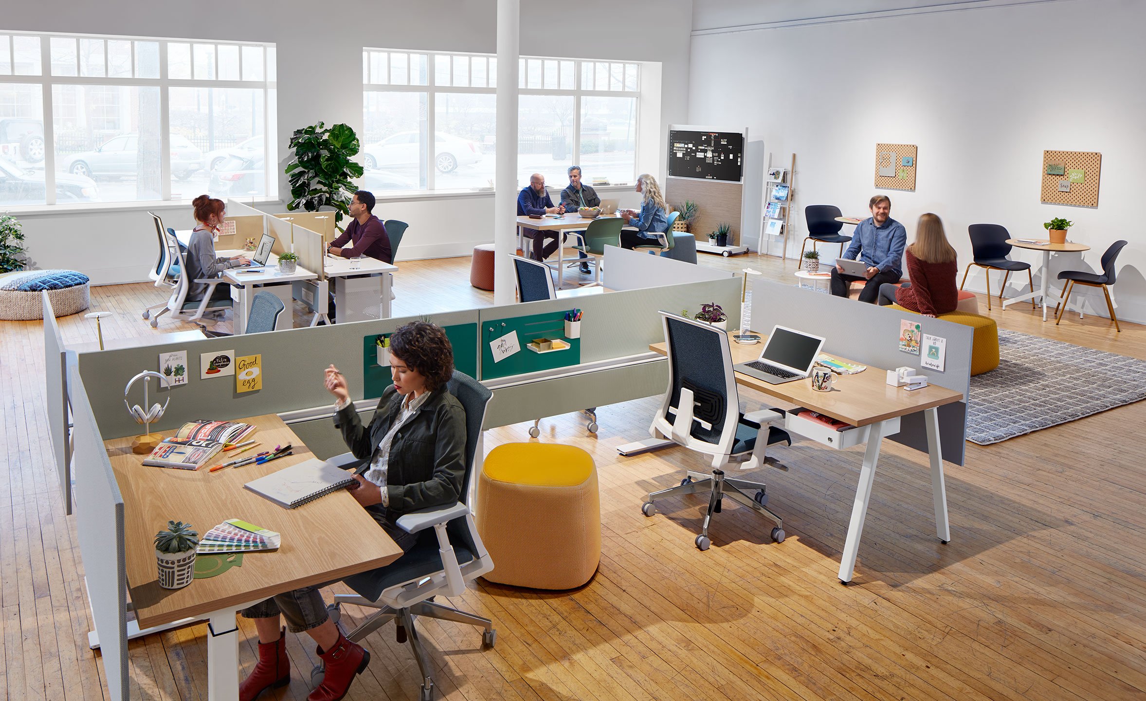 Haworth Compose Beam Workspace Divider in an open office space with employees working together and sitting at desks