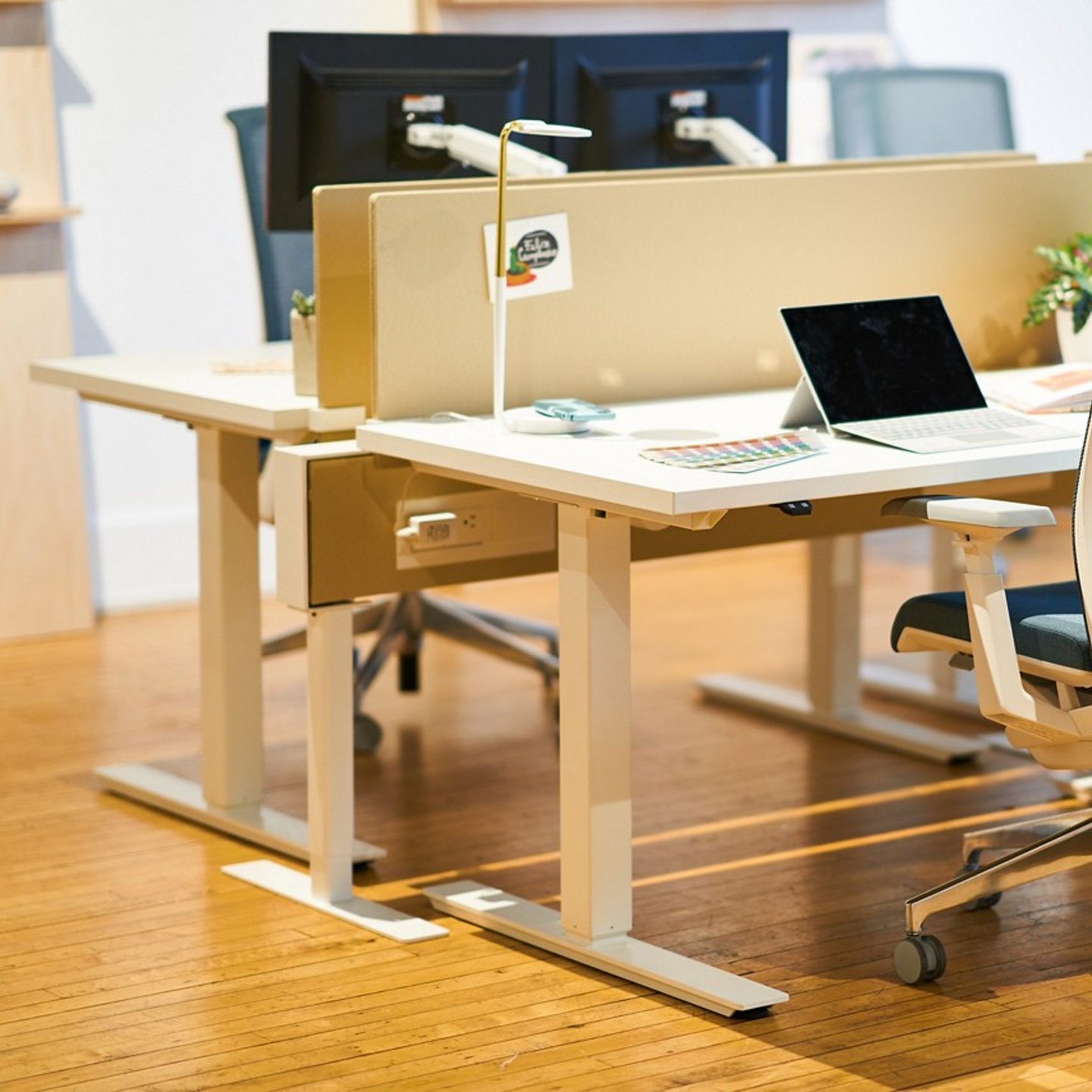 Haworth Compose Beam Workspace divider between desks with a chair in office space