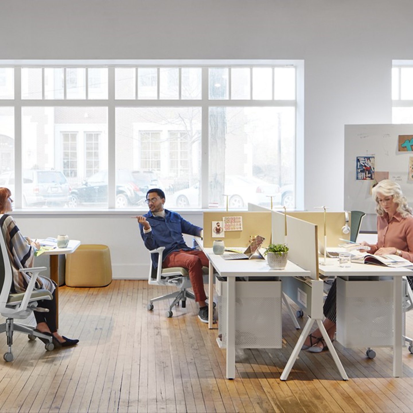 Haworth Compose Beam Workspace Divider in office space with employees working at desks and talking