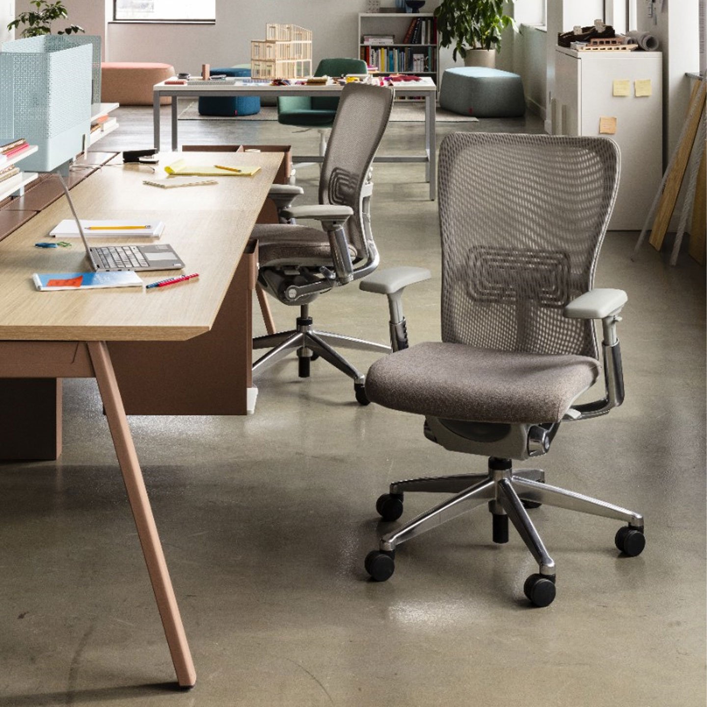 Haworth Intuity Workspace divider in office setting with wood desks and haworth chairs 