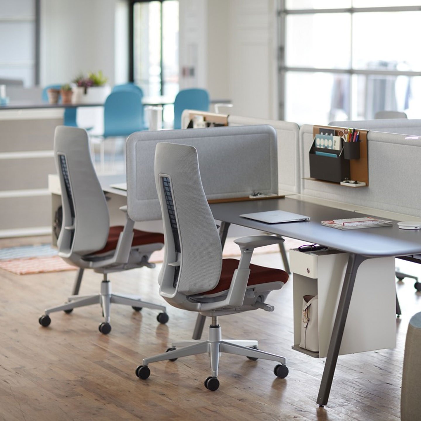 Haworth Intuity Workspace divider in open office space with desks with storage compartments and fern chairs