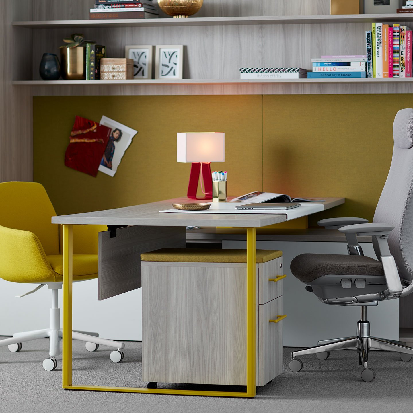 Haworth Masters Series Workspace with laminate desk in private office space with grey shelving above desk with grey and yellow chair