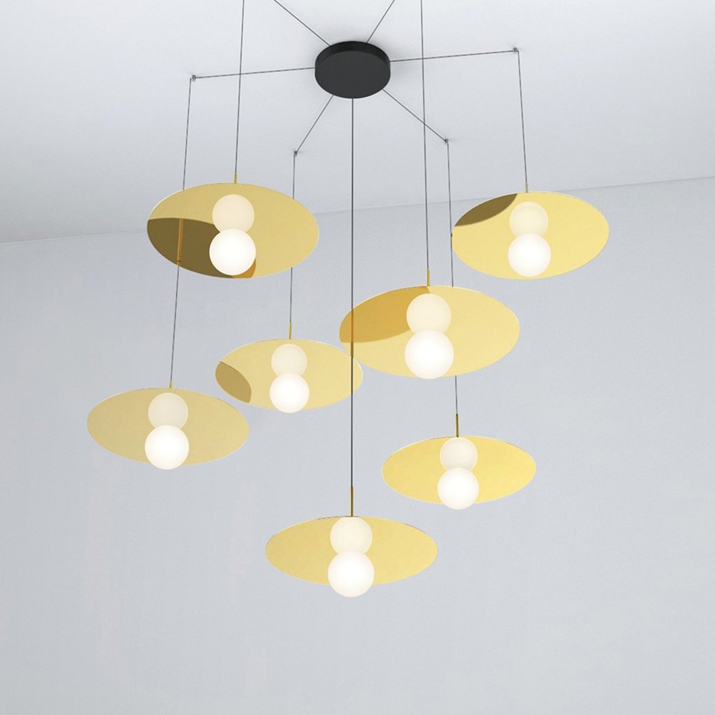 Haworth Bola Disc Lighting with gold metal disc coming down from ceiling 