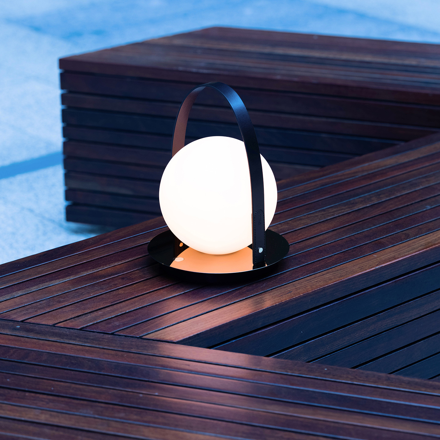 Bola Lantern's elegant scale with wide-ranging finish combos makes it a perfect centerpiece to gather around.