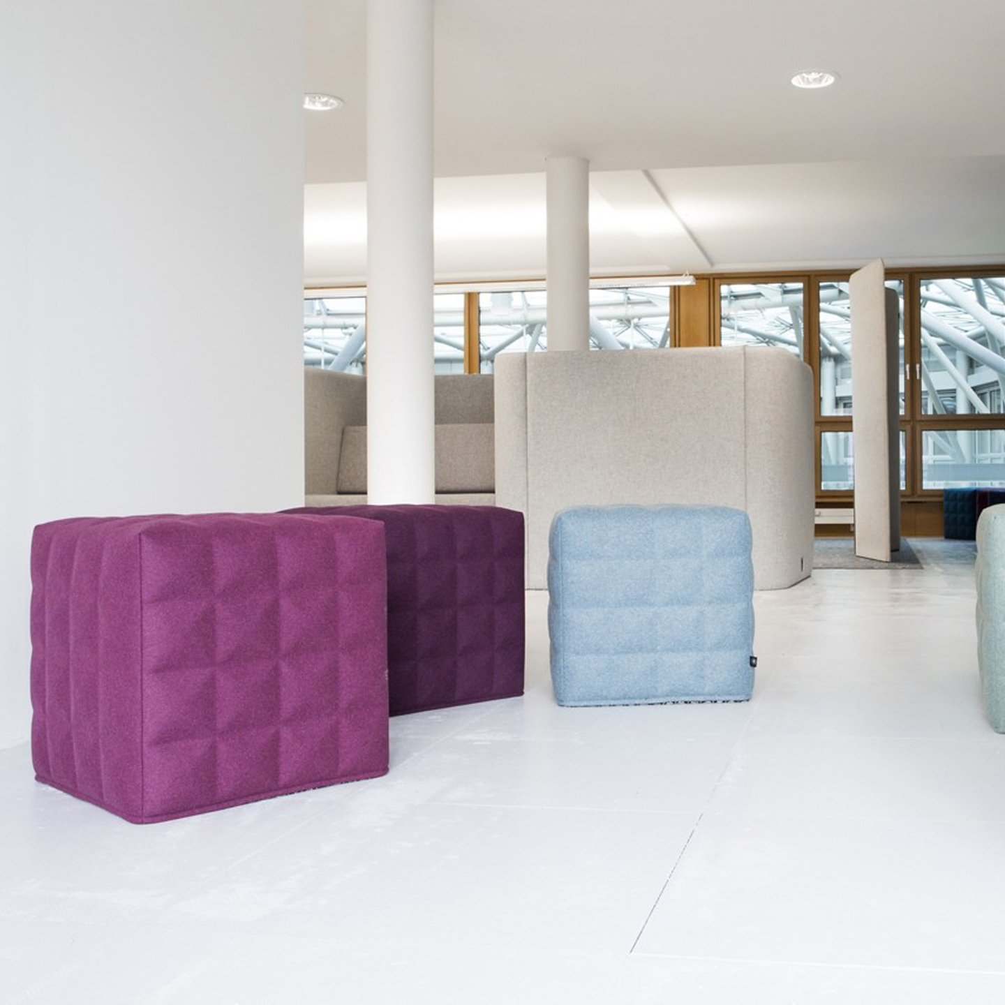 Haworth Buzzicube seating in pastel shades like pink, purple, blue
