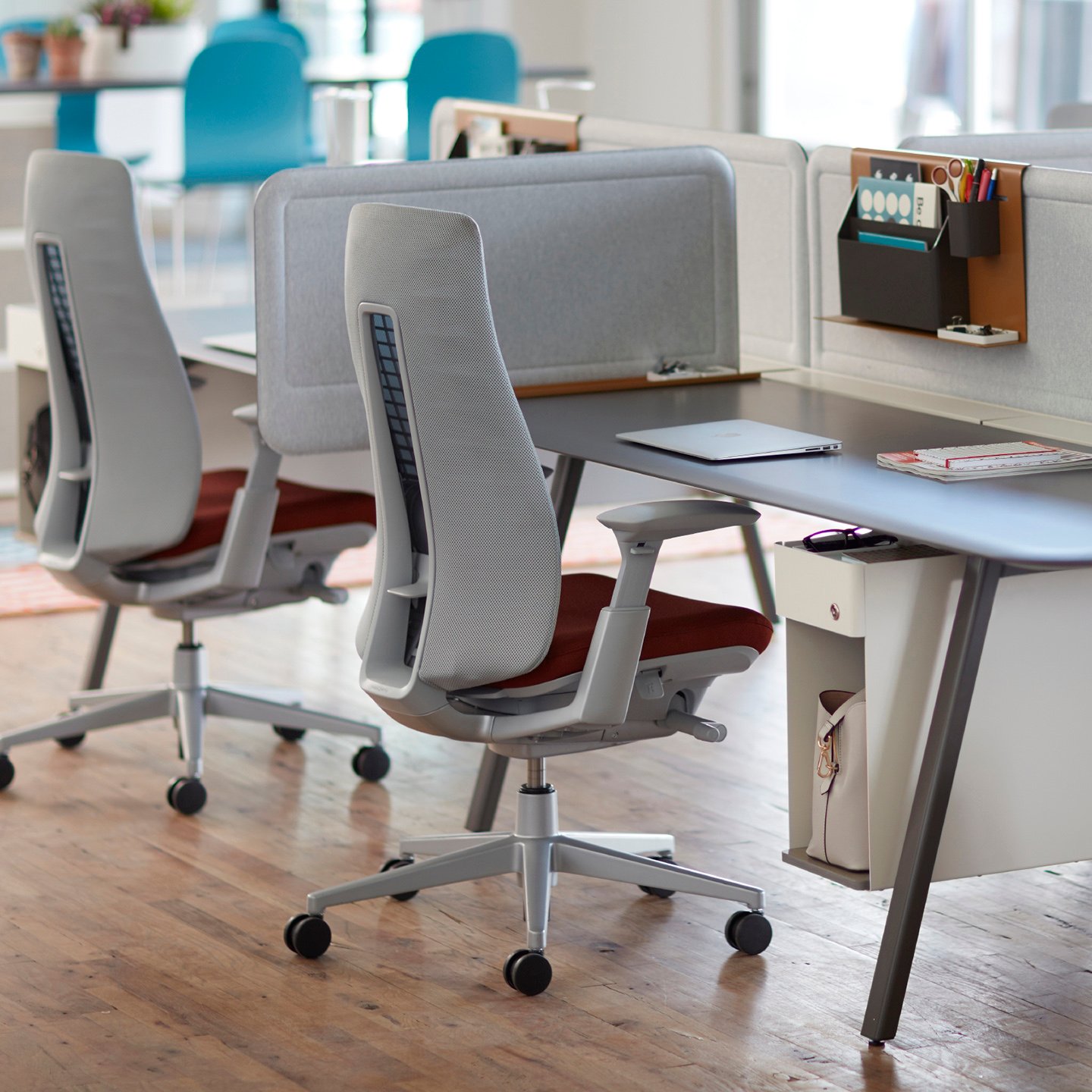 Haworth Fern task chair in grey color with Intuity benching in a office space
