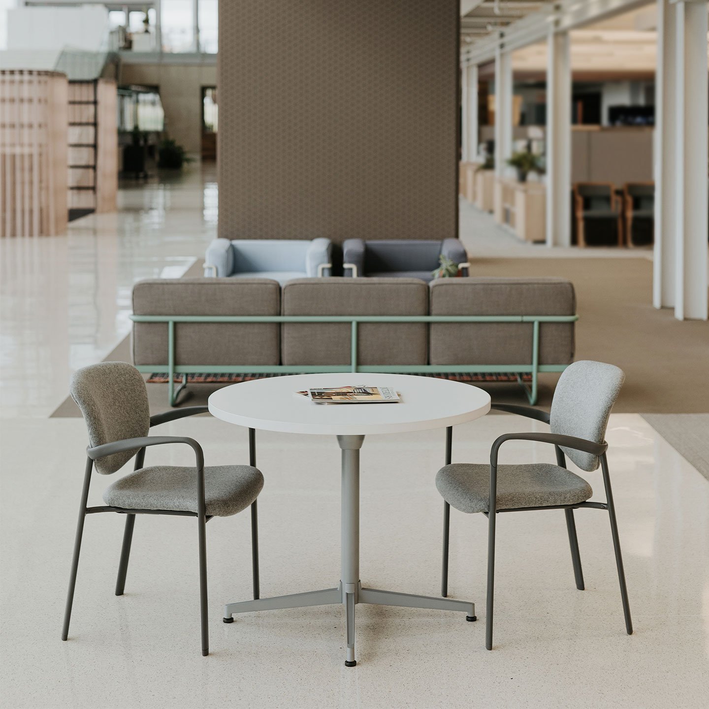 Haworth Improv Side chair in grey and beige upholstery in a lobby area