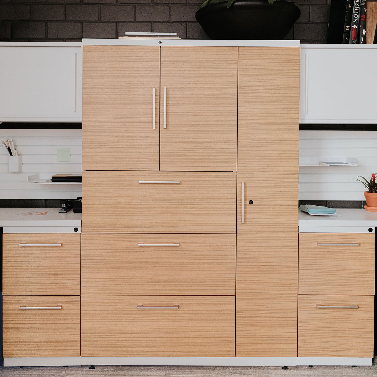 X Series in light wood with drawers and hinge door cabinets