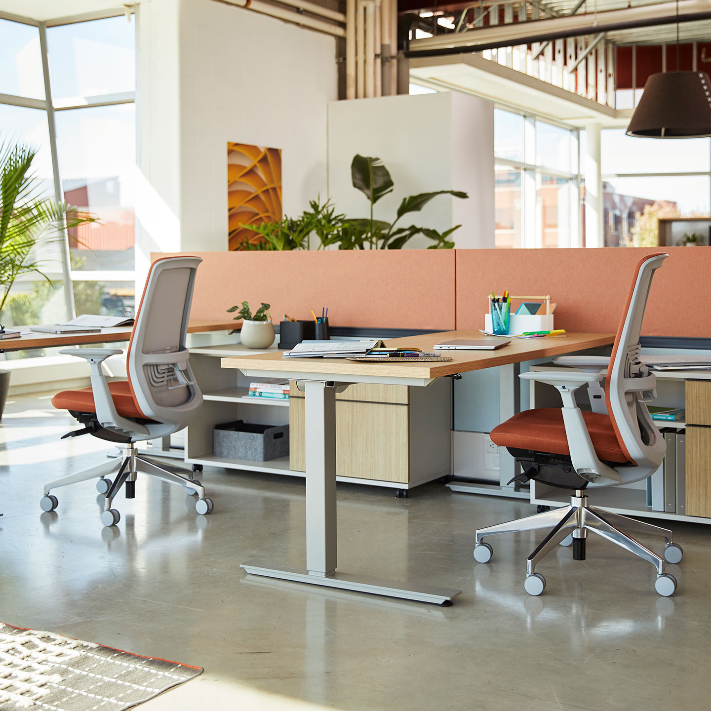 Haworth Height Adjustable Table with Fern Seating in an open office space