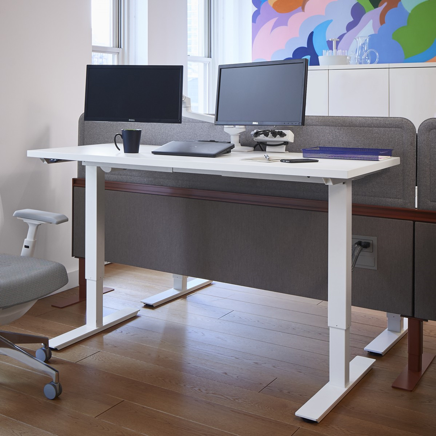 Haworth Height Adjustable Table in a home office space with chair