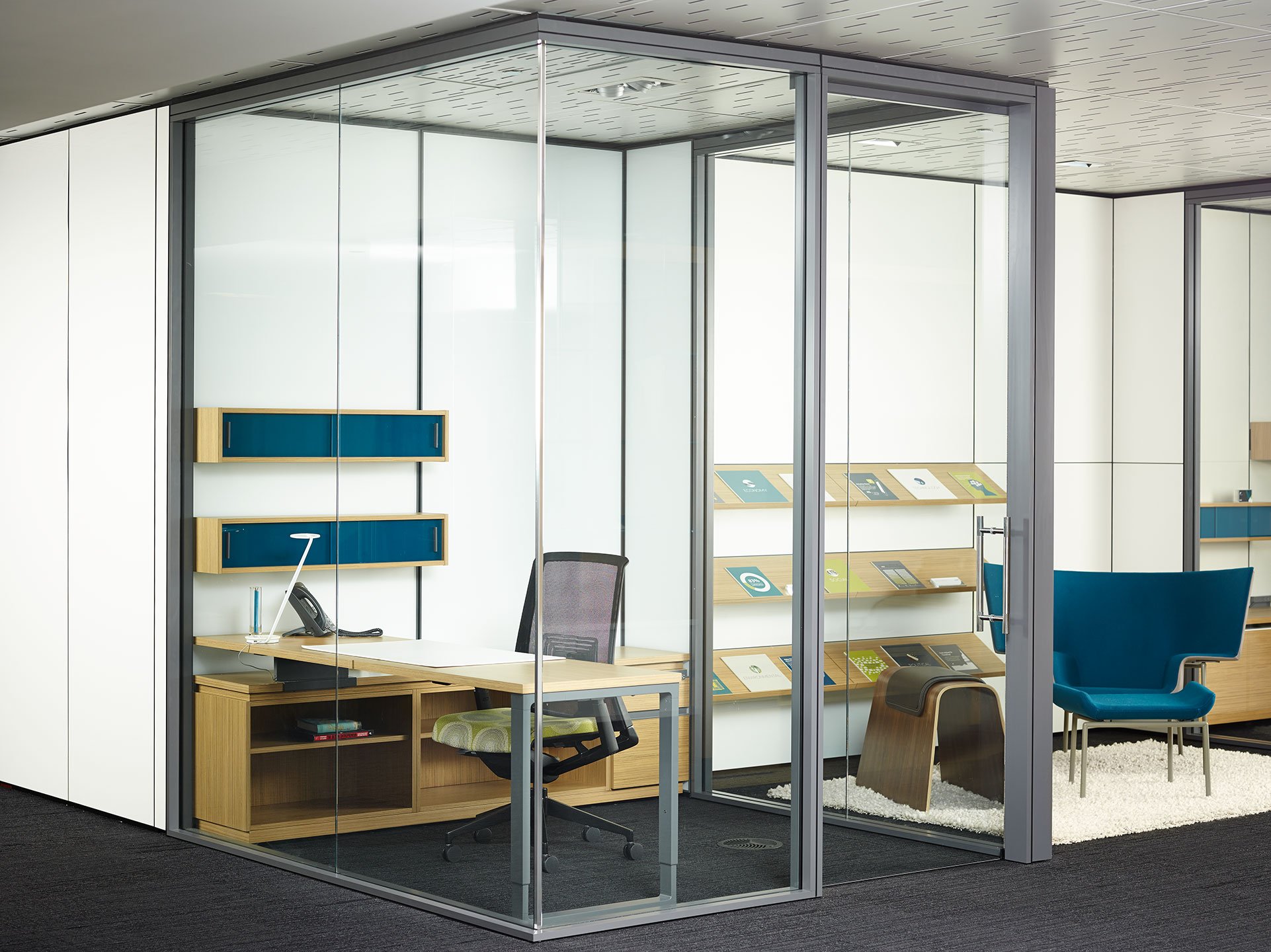 Haworth Enclose Frameless Glass Wall for private office space next to lounge area 