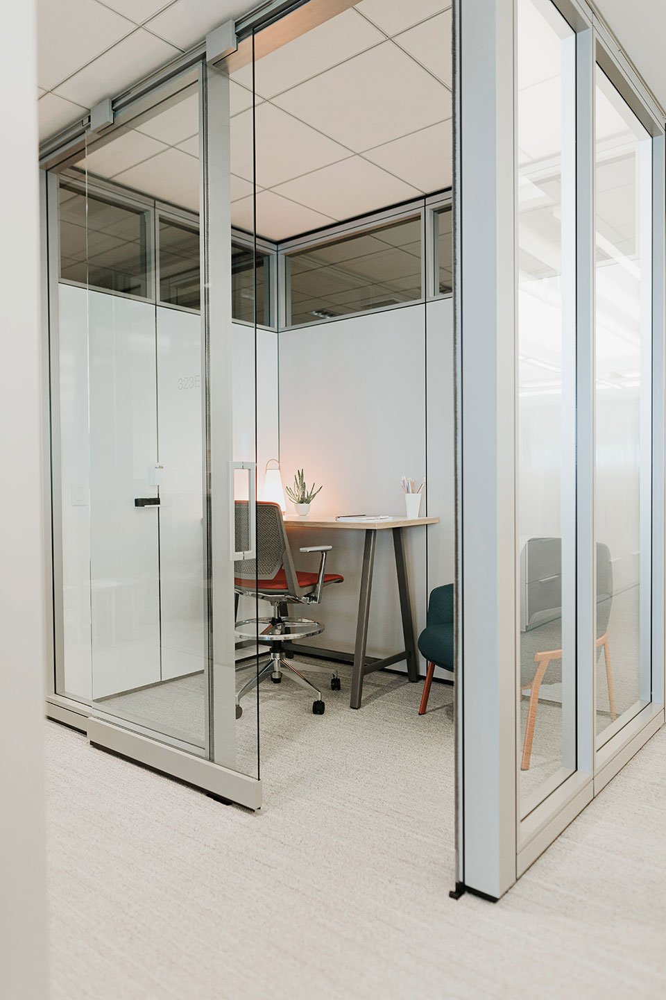Haworth Enclose Wall for private work space with desk and desk chair with white board in space